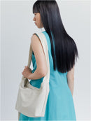 GLOSSY HALFMOON CROSS BAG