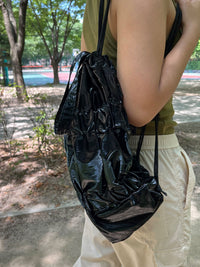 TIERED BANDING BACKPACK