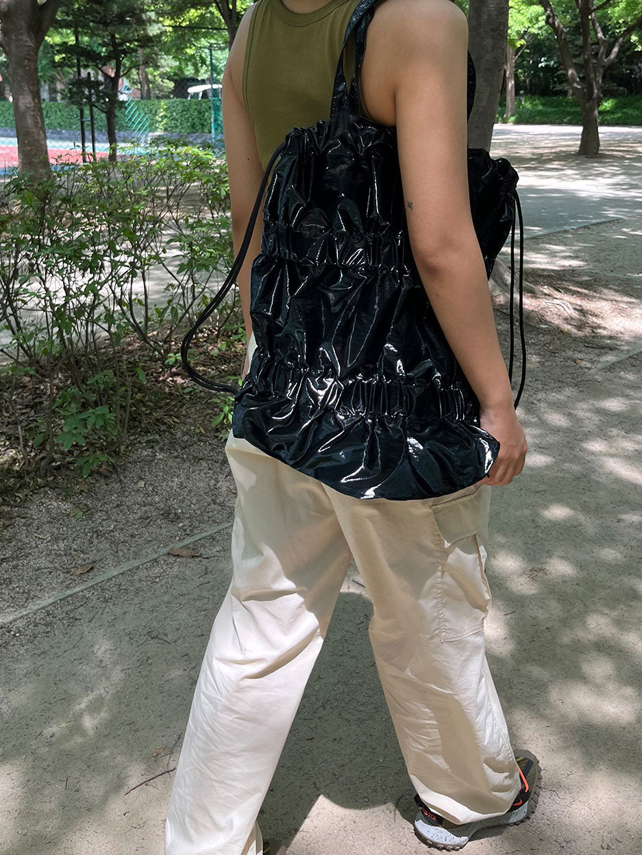 TIERED BANDING BACKPACK