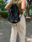TIERED BANDING BACKPACK