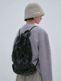 TIERED BANDING BACKPACK