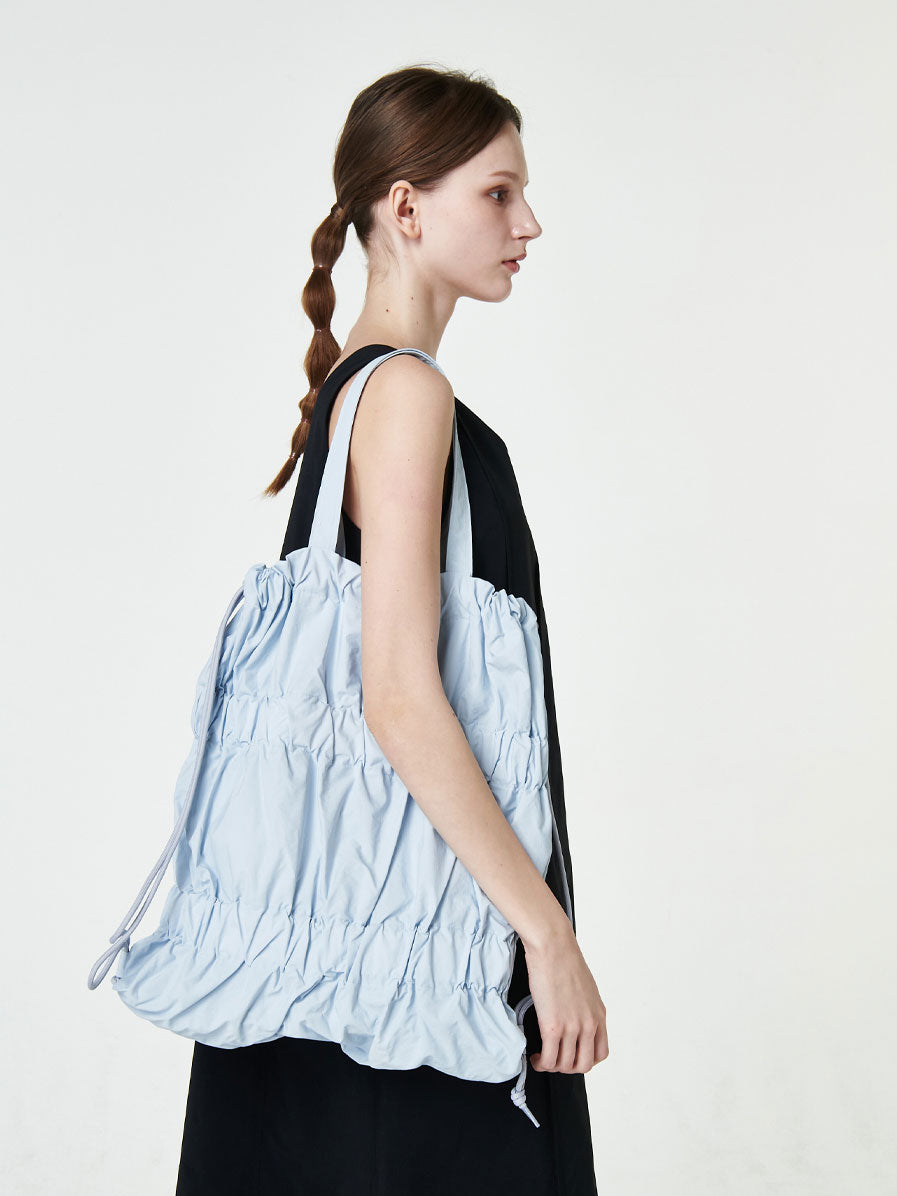 TIERED BANDING BACKPACK