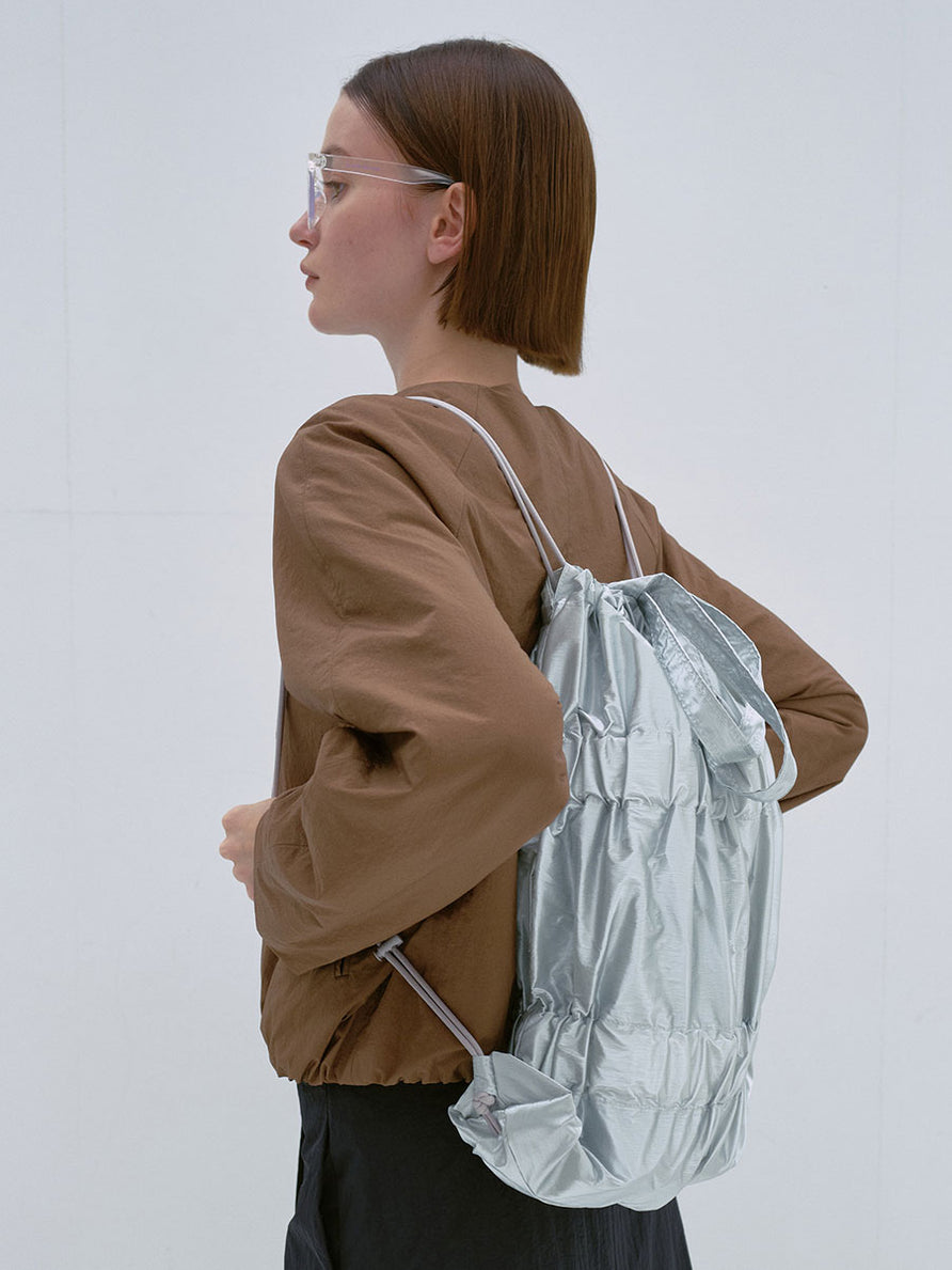 TIERED BANDING BACKPACK