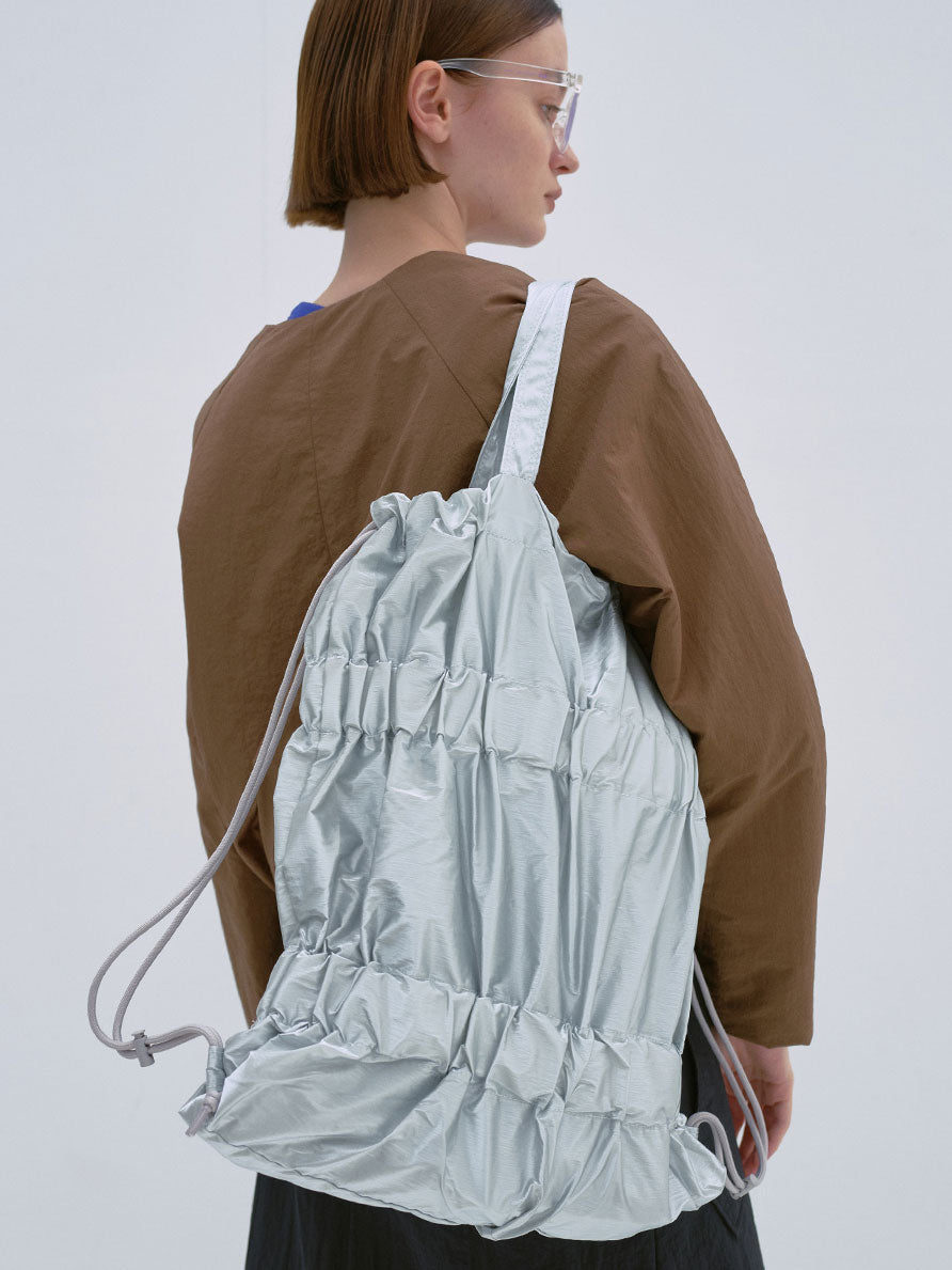 TIERED BANDING BACKPACK