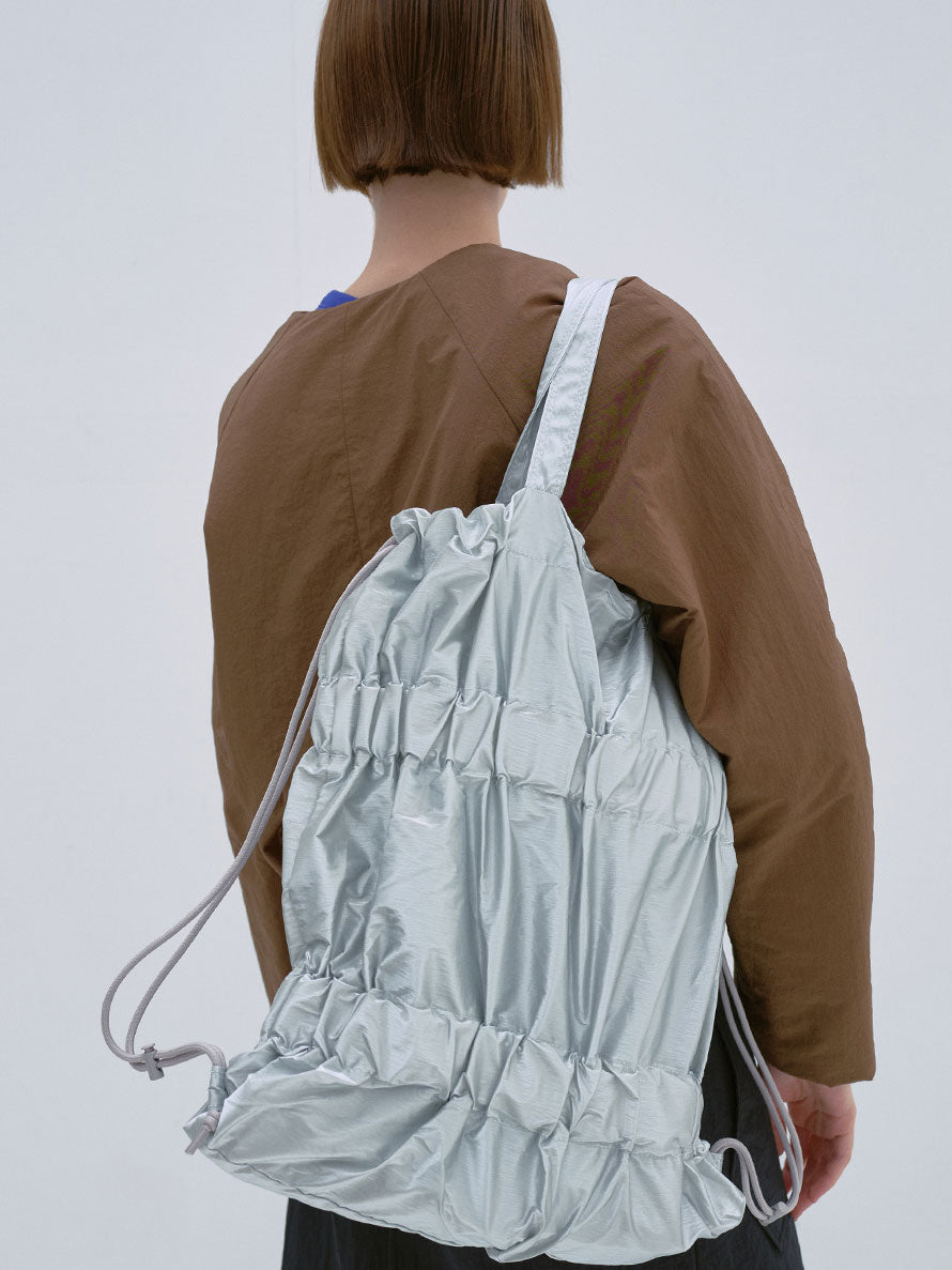 TIERED BANDING BACKPACK